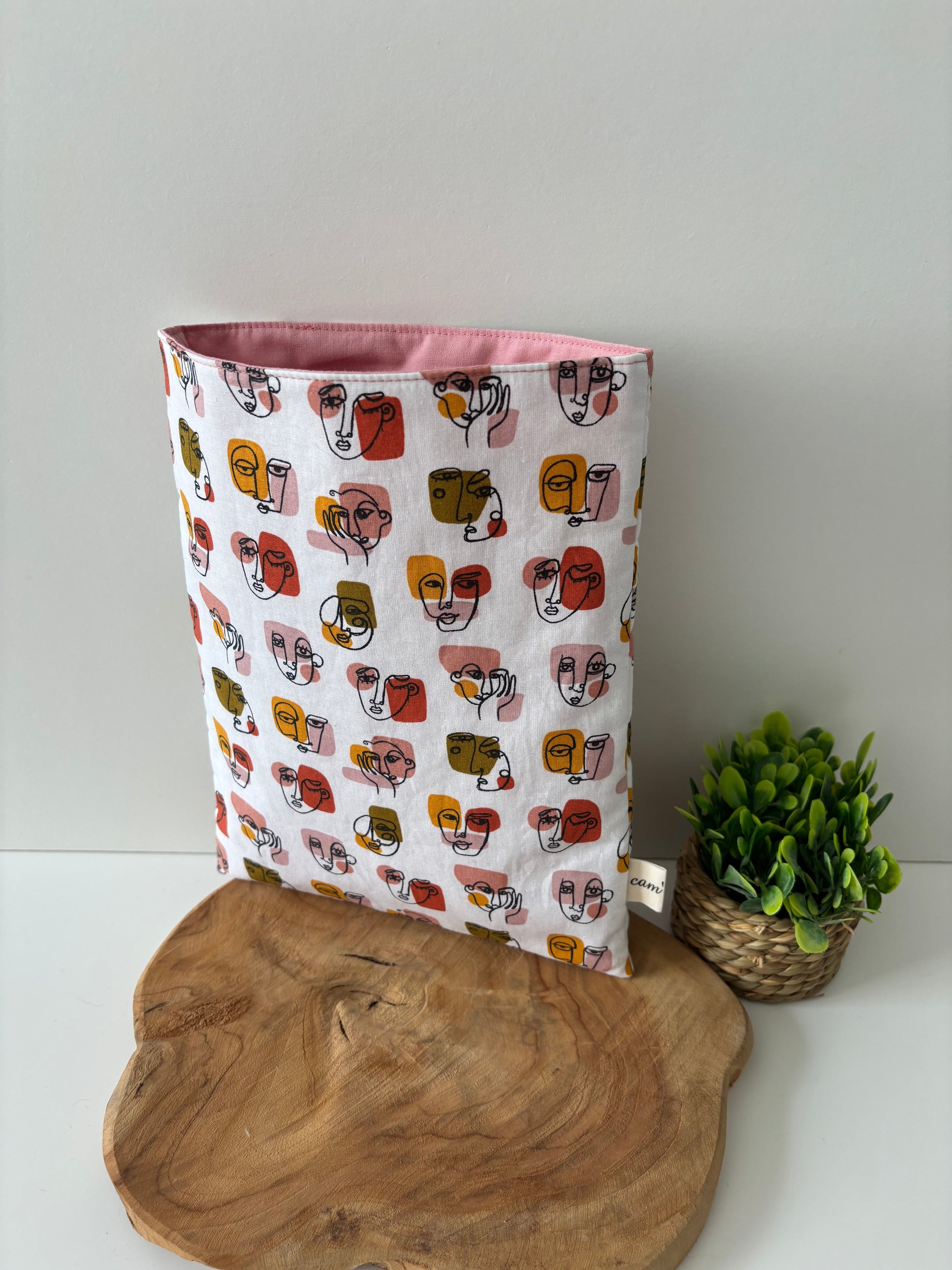 Pochette à livre en coton motif visages abstraits