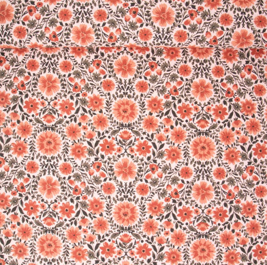 Fleuri orange sur fond rose pâle