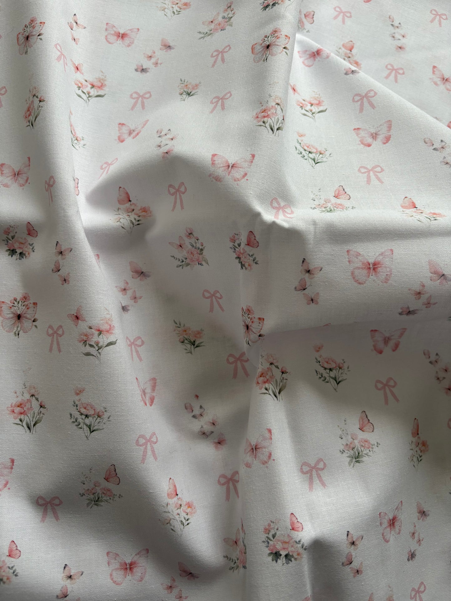 Papillons et noeuds rose